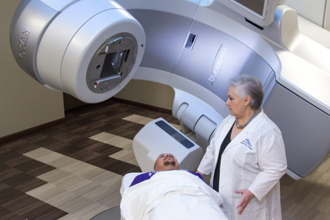 Dr. Claudia Perez-Tamayo operates the TrueBeam STx system at Heartland Cancer Center.